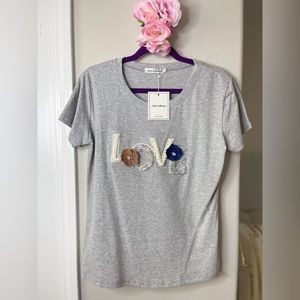 Gray T Shirt with  embellishments.